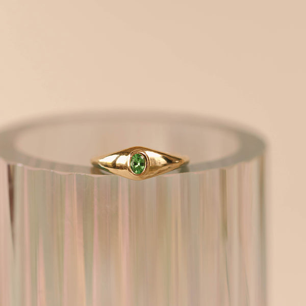 14k Gold ring with an oval cut Tsavorite garnet, bezel set. 