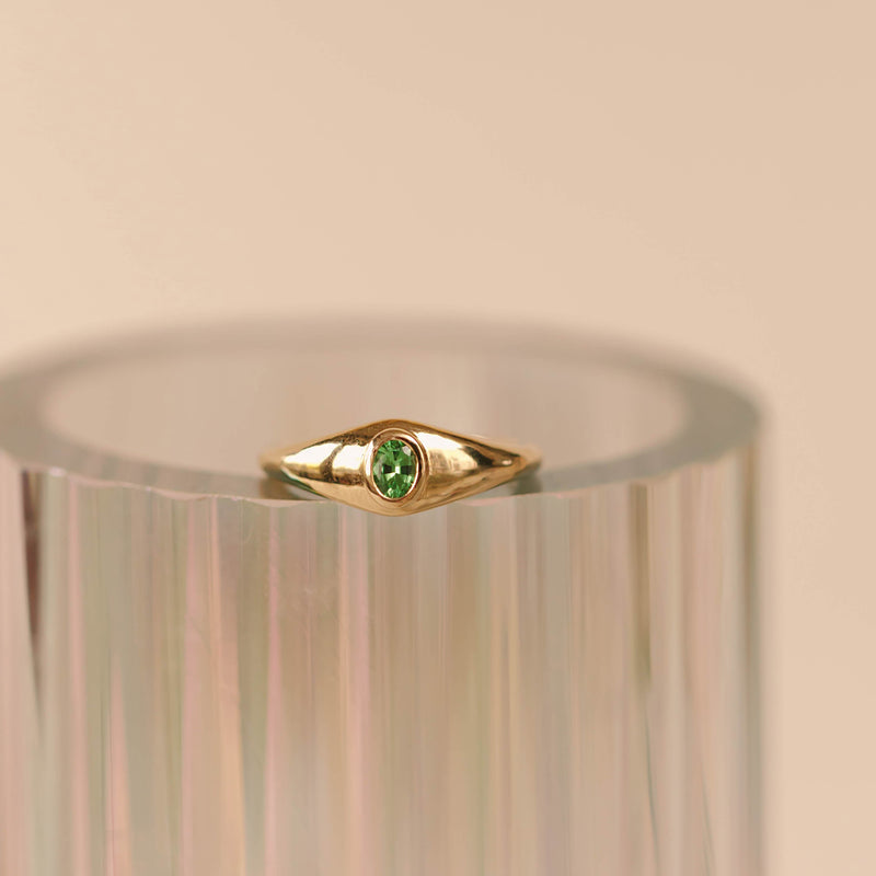 14k Gold ring with an oval cut Tsavorite garnet, bezel set. 